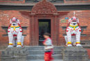 Woman walking past Kumari Bahal, Kathmandu