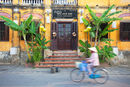 Woman cyclist, Hoi An, Vietnam