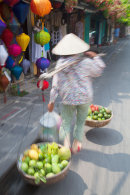 Woman carrying fruit, Hoi An