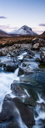 Waterfall, rocks and Marsco in the Snow covered Cuillin Mountains over the River Sligachan at twilight, Isle of Skye, Scotland
