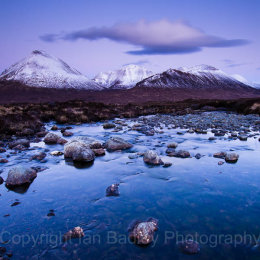 Snow covered Cuillin Mountains over the River Sligachan at twilight, Isle of Skye, Scotland