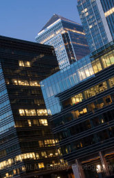 Yellow and blue light of office buildings at twilight, London, England