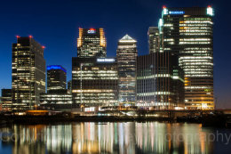 Reflected light of Canary Wharf at night, London, England