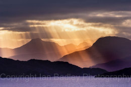 Sun shafts through storm clouds on Loch Torridon, Highlands, Scotland
