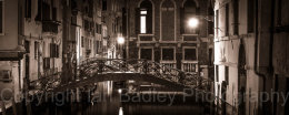 Bridge over a canal at night in Venice, Italy
