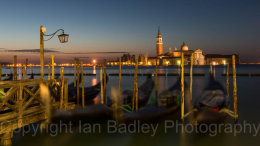 Dawn twilight over gondola and Saint Georgio, Venice, Italy