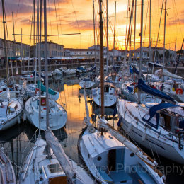 Sunset over the yacht basin at St Martin, Ile de Re, France