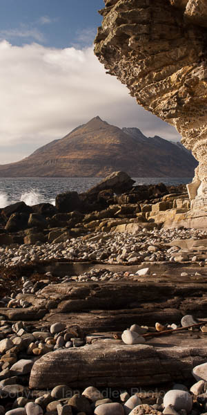 Smooth rocks and shaped cliff overlooking the sea and Cuillin Mountains at Elgol on Isle of Skye, Scotland