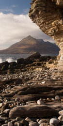 Smooth rocks and shaped cliff overlooking the sea and Cuillin Mountains at Elgol on Isle of Skye, Scotland