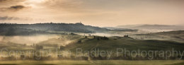 Misty dawn over the UNESCO Val d'Orcia, below Pienza, Tuscany, Italy