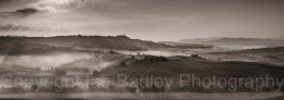Misty dawn over the UNESCO Val d'Orcia, below Pienza, Tuscany, Italy