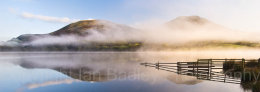 Mist rising at sunrise on Loweswater, Lake District National Park, Cumbria, England