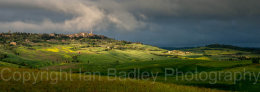 Storm clouds and sunlight on Pienza, Tuscany, Italy