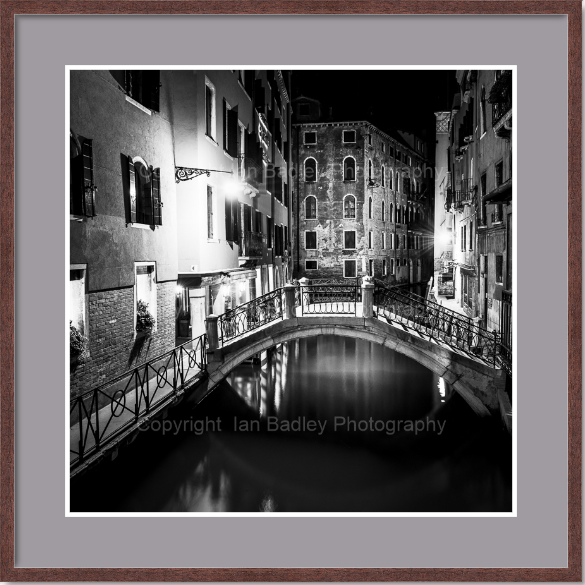 Black and white Venice canal at night