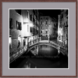 Black and white Venice canal at night