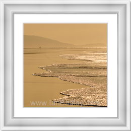 Lone woman on golden Harris beach