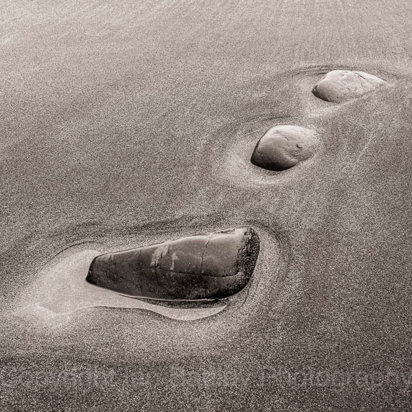 Three stones in sand, Argyll, Crinan, Scotland
