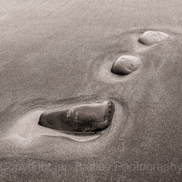 Three stones in sand, Argyll, Crinan, Scotland
