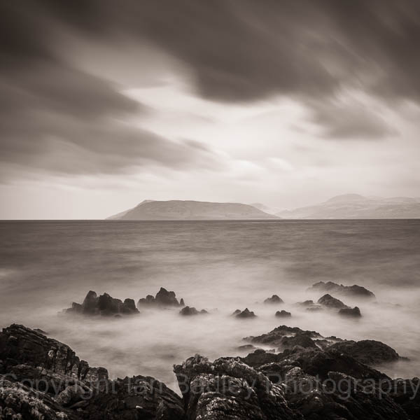 Rocks and ethereal sea overlooking the Isle of Arran, Scotland