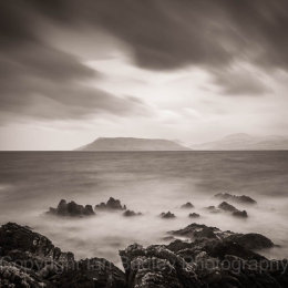 Rocks and ethereal sea overlooking the Isle of Arran, Scotland