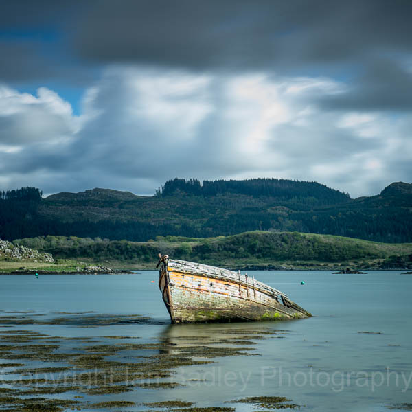 Sunken wooden boat on the west coast of Scotland