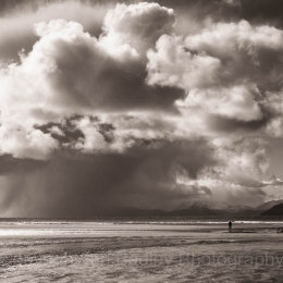 Lone walker on Red Point beach on the north west coast of Scotland
