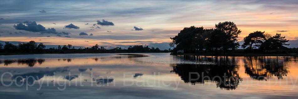 Cloud reflections in Hatchet Pond, Beaulieu, New Forest National Park, Hampshire, England