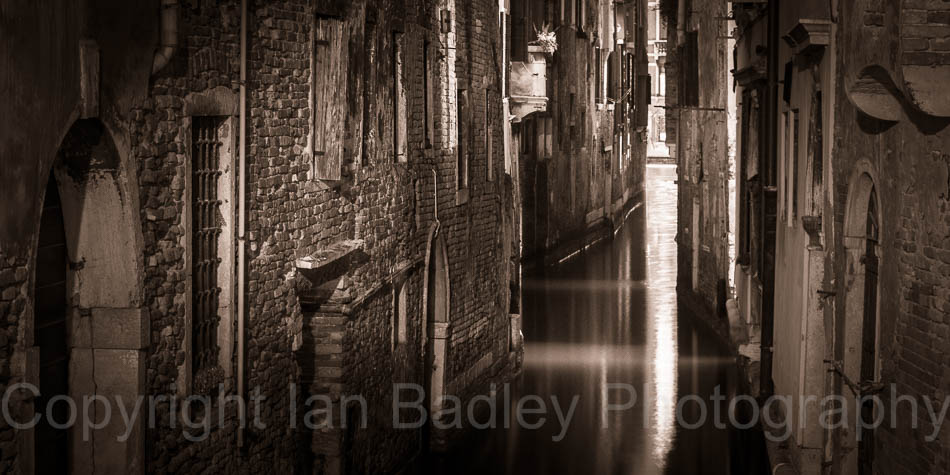 Light in a dark canal, Italy, Venice