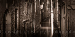 Light in a dark canal, Italy, Venice
