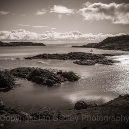 Moored yacht in a quiet bay on the Isle of Harris, Scotland