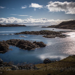 Moored yacht in a quiet bay on the Isle of Harris, Scotland
