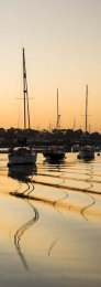 Moored sailing yachts at dawn on the River Hamble, Hampshire, England