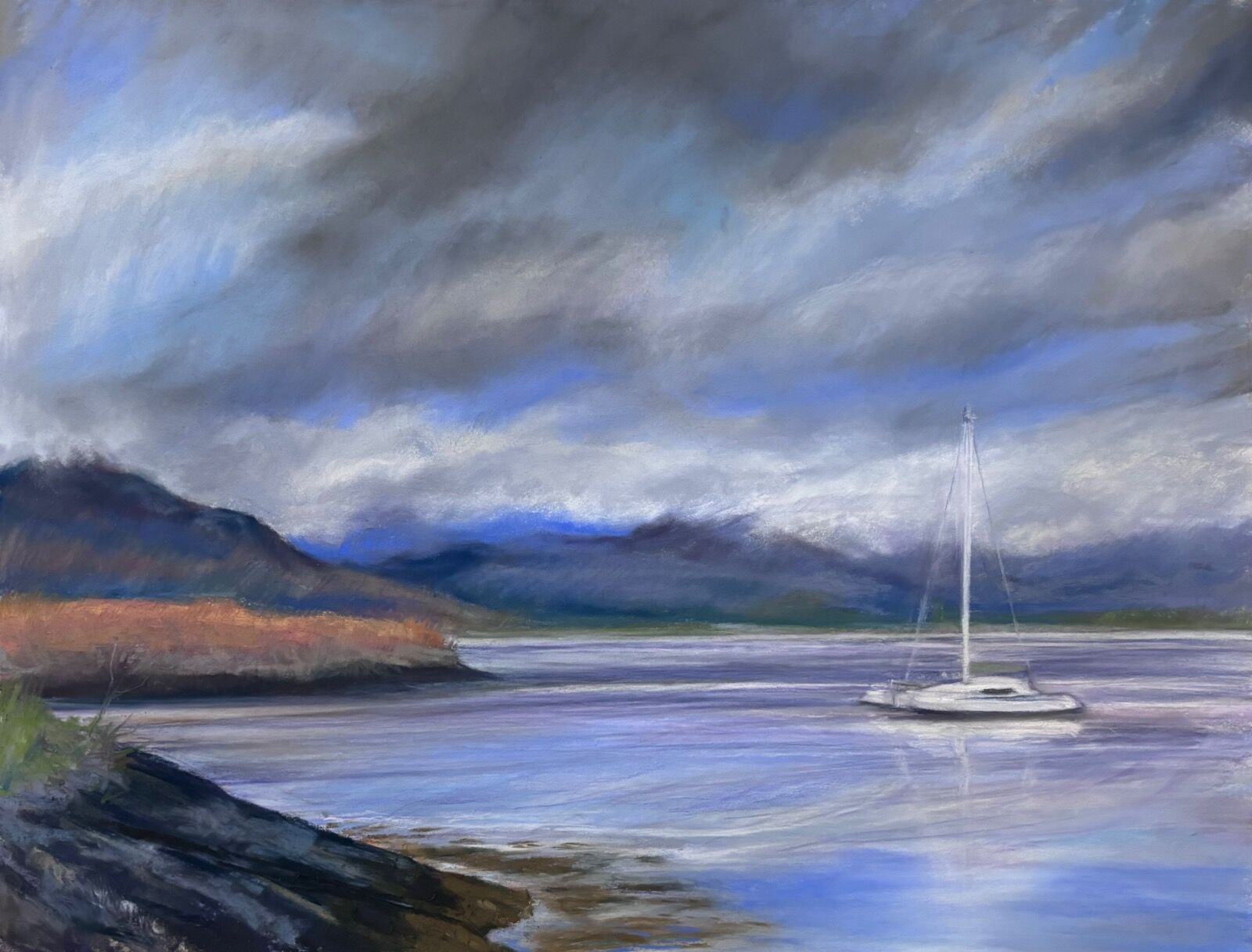 Small Sailing boat going back to the boat club harbour at Oban