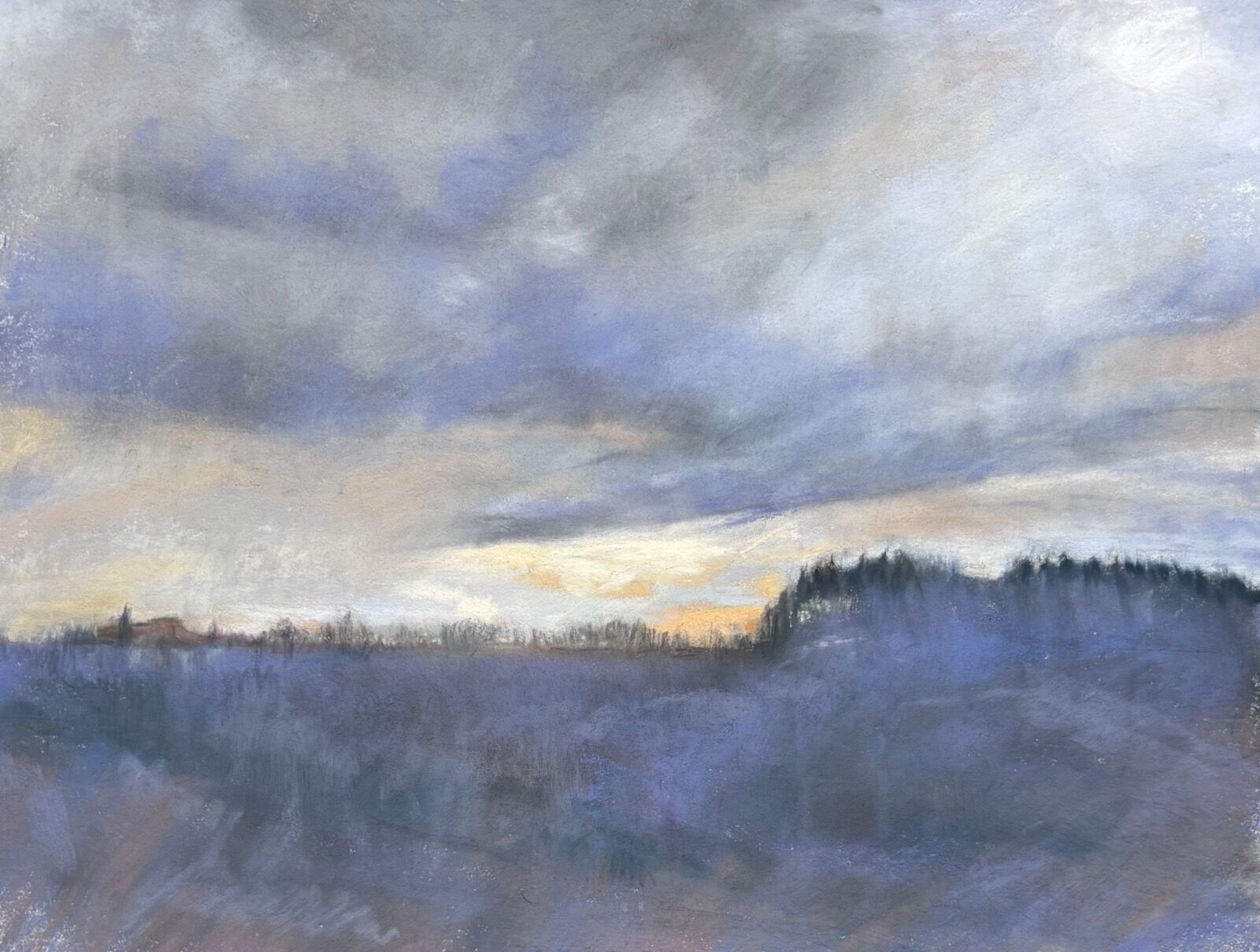 View across the Belbo Valley late afternoon with sunset and purple clouds