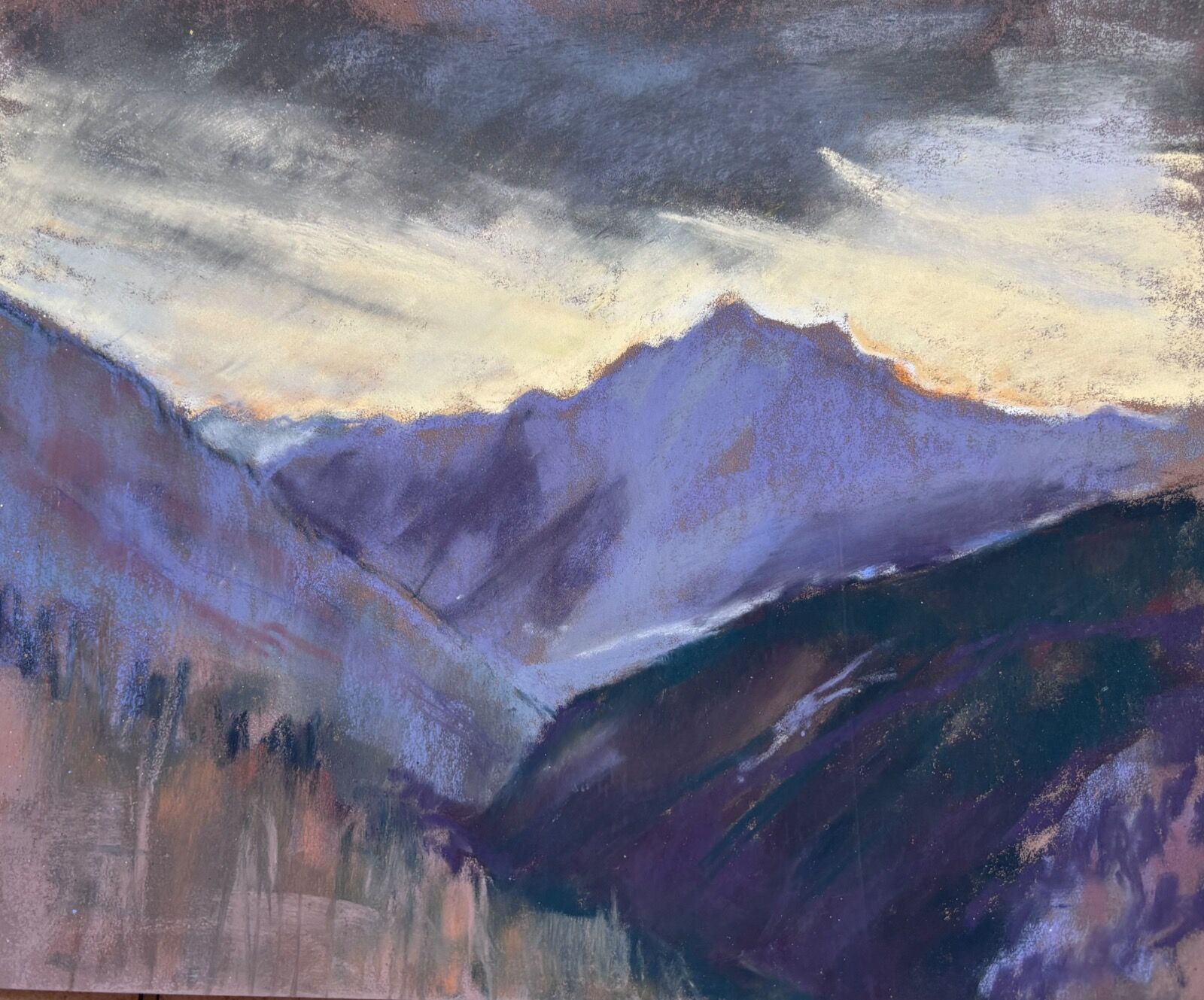 View down the Champoluc valley with sunset behind the mountain