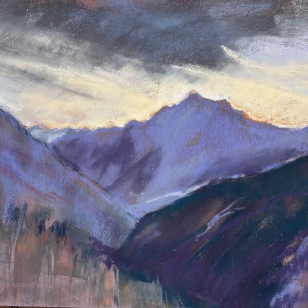 View down the Champoluc valley with sunset behind the mountain