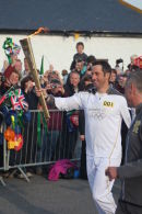 Ben Ainslie carrying the Olympic Flame at Land's End