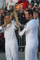 Ben Ainslie with the Olympic Flame at Land's End