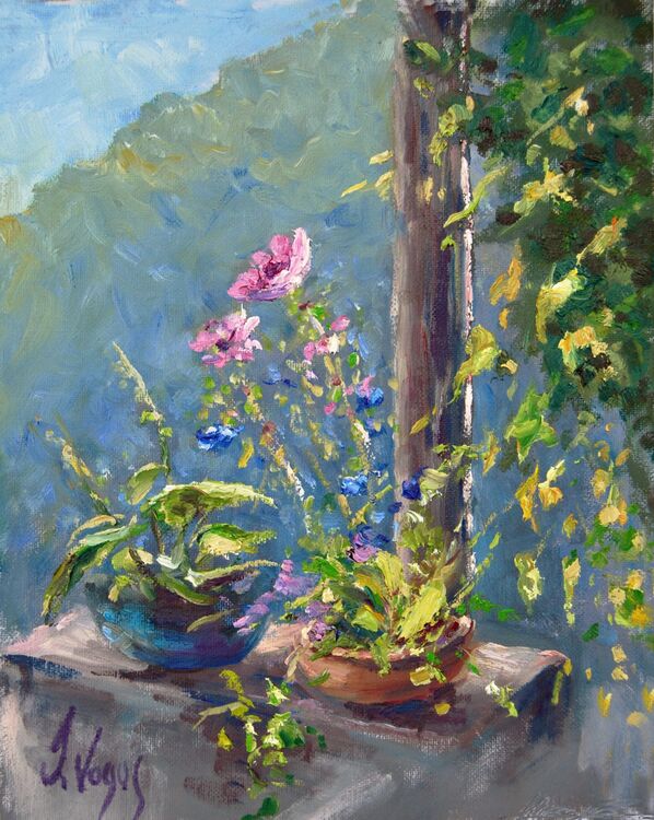 Sunlit flowers on Tessiner Terrace. Switzerland