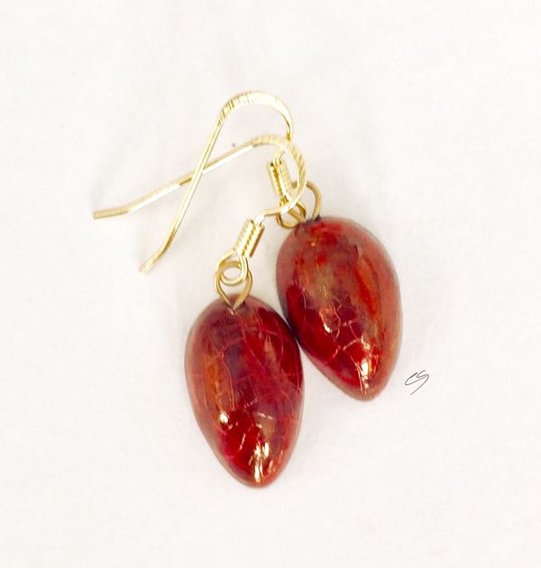 Red teardrop ceramic earrings with crackle glaze.