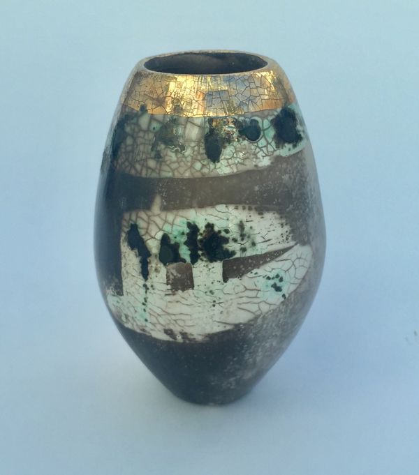 Upright smoke-fired ceramic pot with gold lustre.