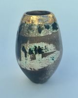 Upright smoke-fired ceramic pot with gold lustre.