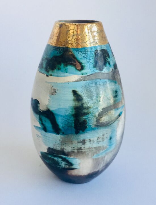 Blue smoke-fired pot with gold lustre.