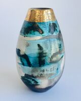 Blue smoke-fired pot with gold lustre.