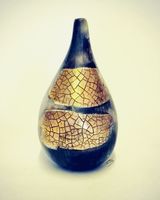 Small gold lustre, smoke-fired porcelain pot.