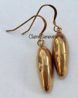 Gold drop earrings.