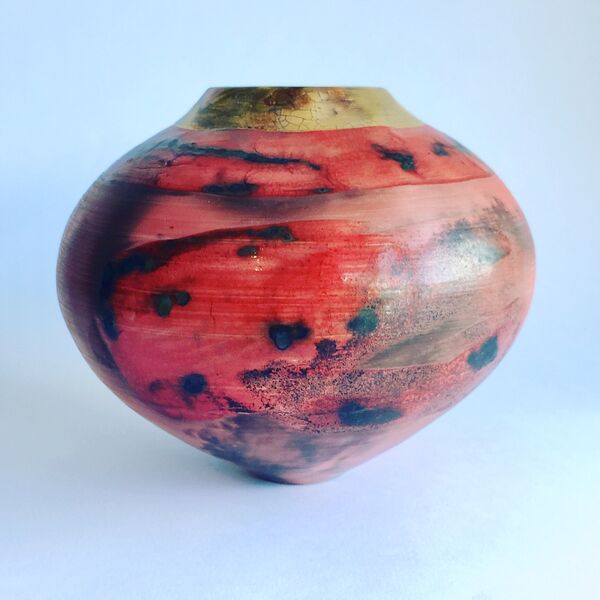 red smoke-fired pot with gold lustre.