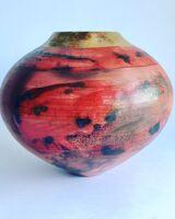 red smoke-fired pot with gold lustre.