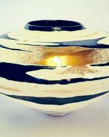 Ceramic pot with gold lustre.