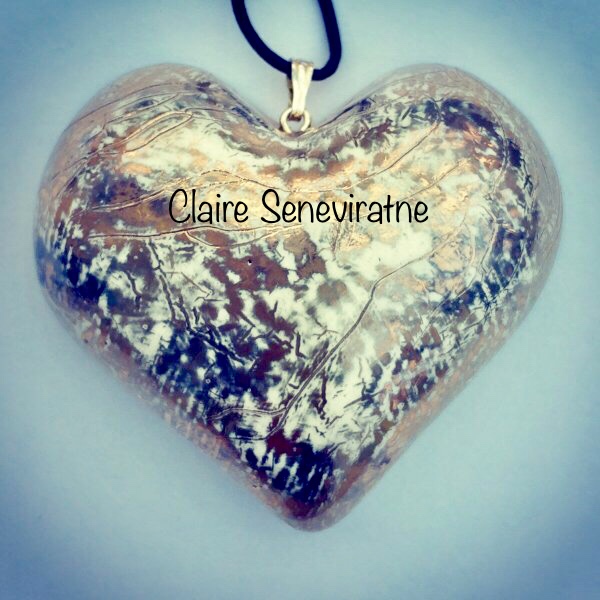 Large Gold and platinum heart pendant.